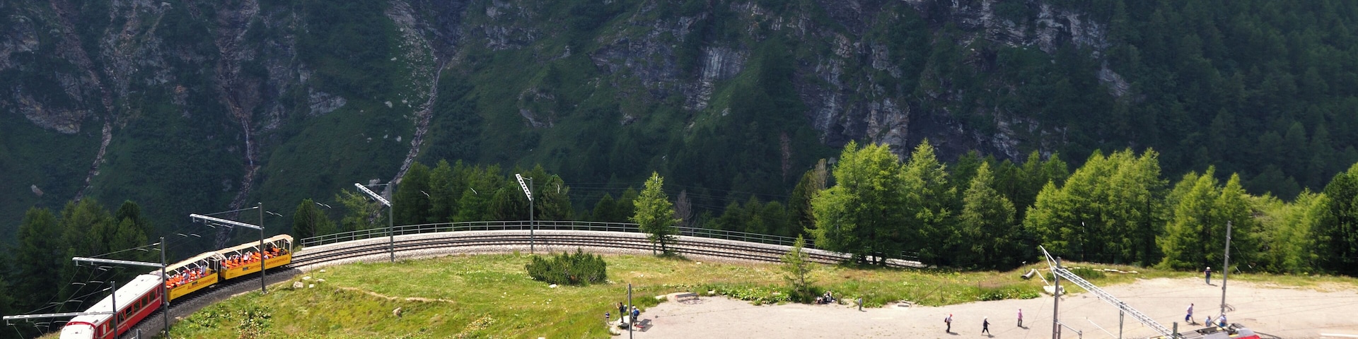 Switzerland, GraubĂŒnden, a North bound regional train with a new ABe 8/12 is entering Alp GrĂŒm station