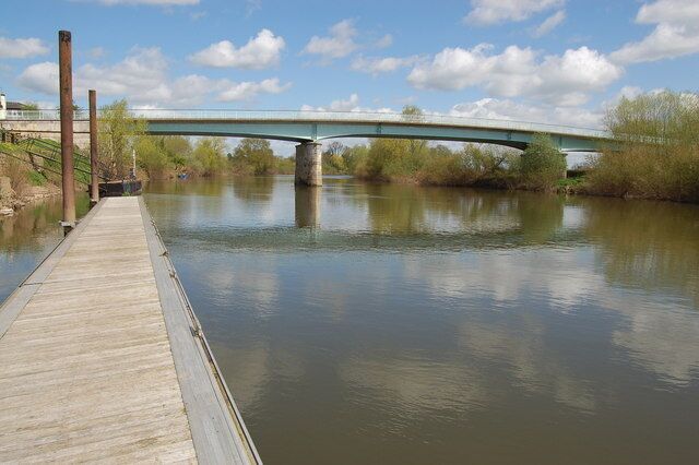 The Haw Bridge over the river Severn This bridge was completed in September 1961 following an accident in December 1958 when a barge struck its predecessor causing it to collapse. Replacing a ferry the original bridge on this site was constructed in 1824 at the behest of the people of Cheltenham hoping trade with south Wales might by-pass Gloucester! In former times at periods of low water the Severn was fordable at this point and the crossing was known as "Haw Passage".