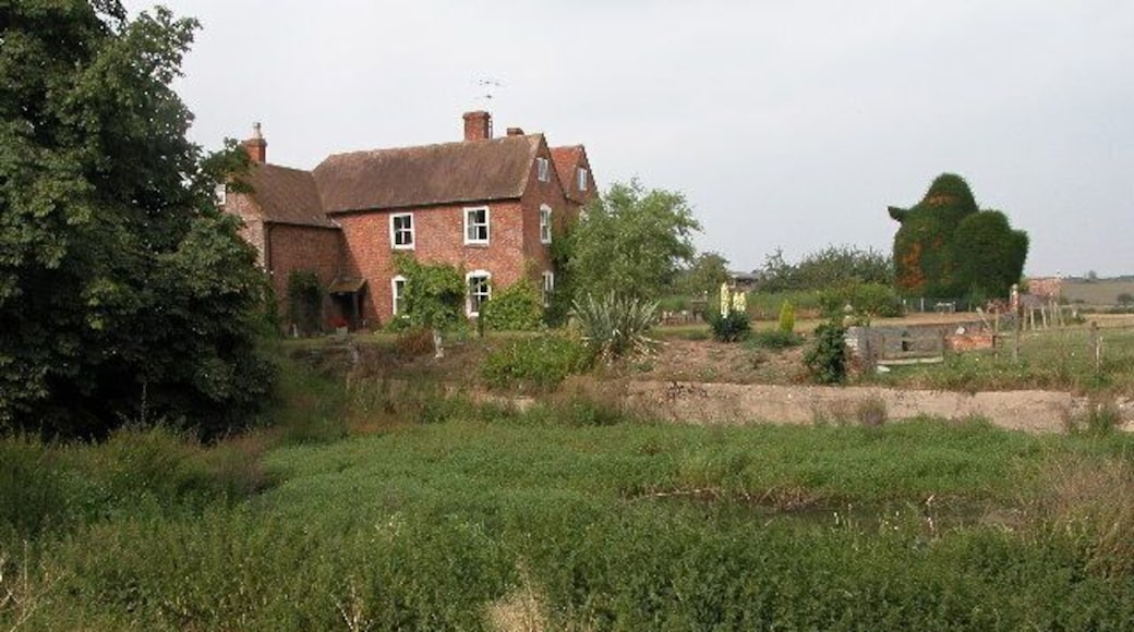 Wigwood Farm, Tirley. Farmhouse overlooking an overgrown pond.
