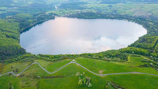 view of Lake Issarles with a motorhome in the foreground, Le Lac-d'Issarles, Ardeche, Auvergne-Rhône-Alpes, France