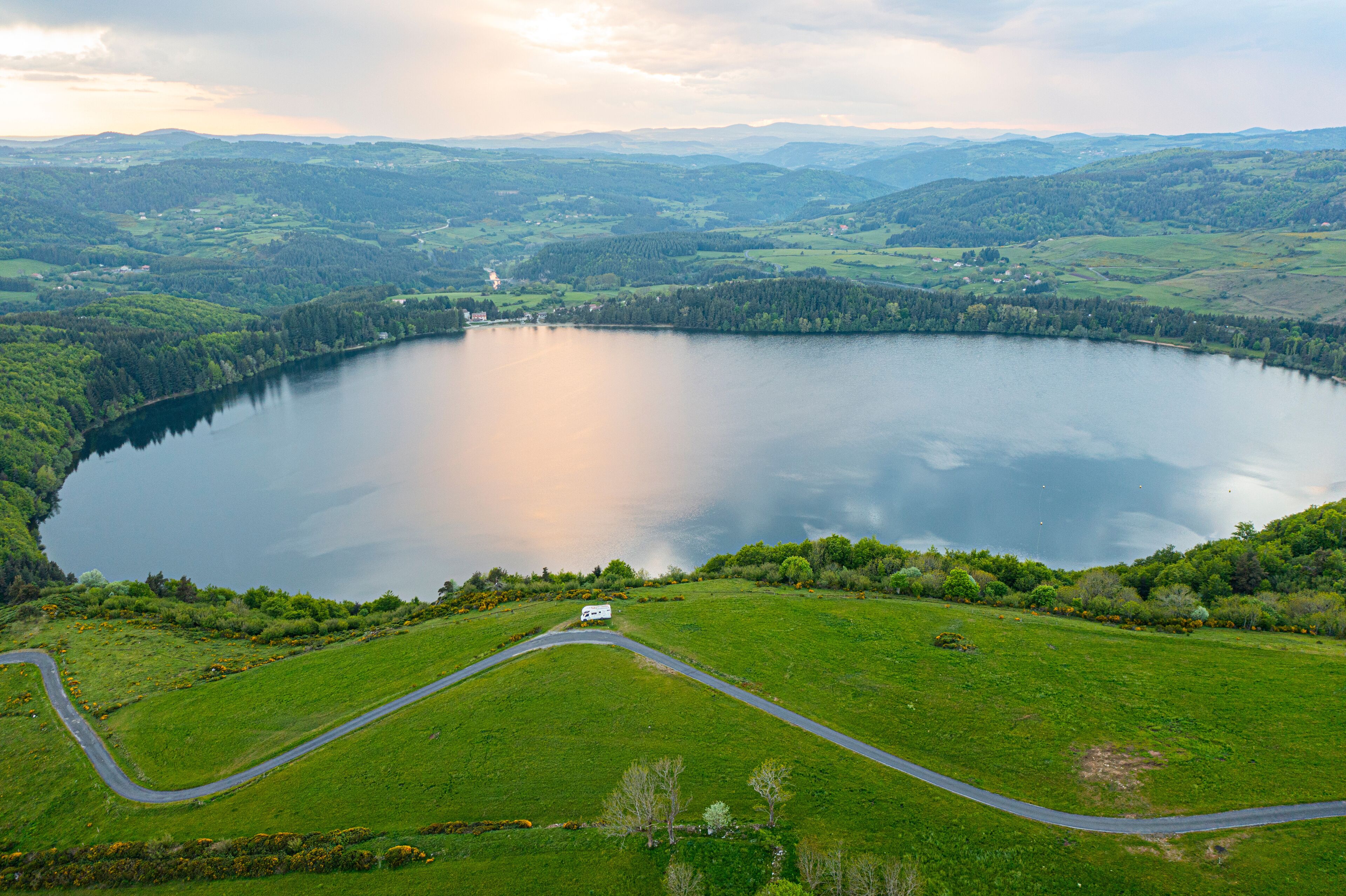 view of Lake Issarles with a motorhome in the foreground, Le Lac-d'Issarles, Ardeche, Auvergne-Rhône-Alpes, France