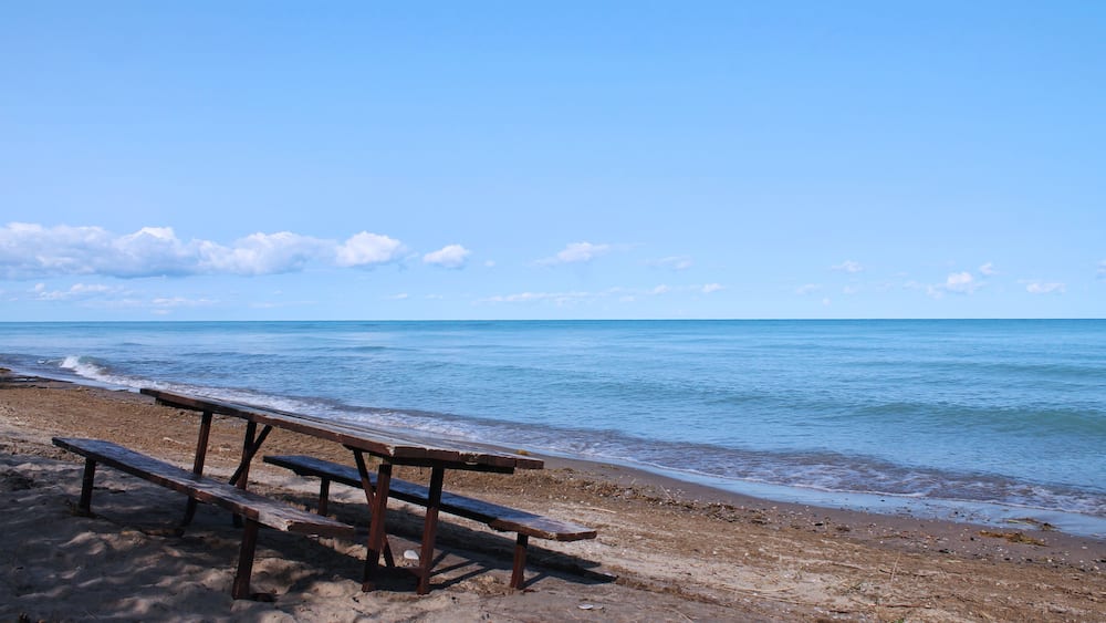 Isolated Picnic table on the Beautiful Beach of Huron Lake near Goderich, Ontario, Canada