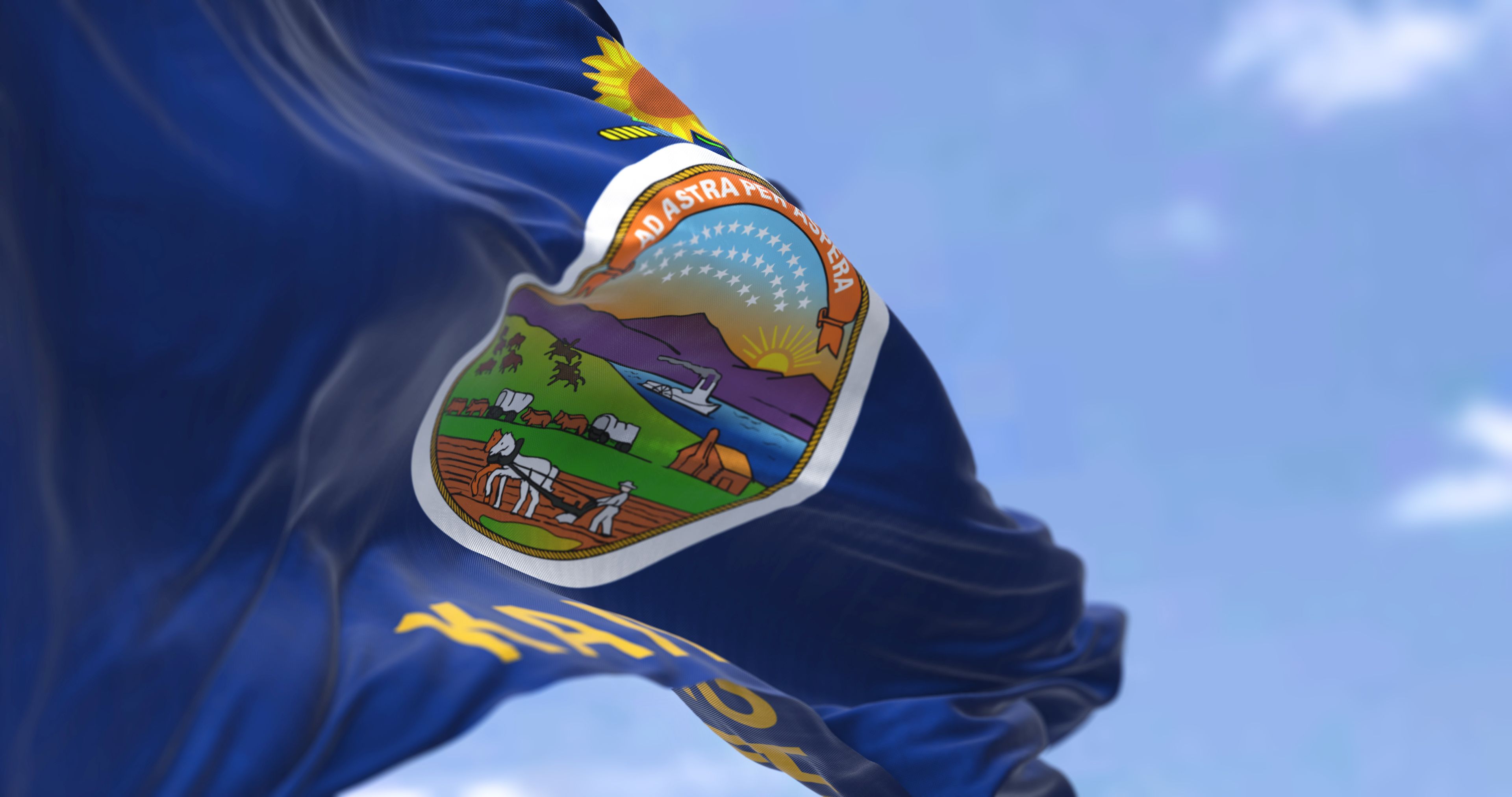 The US state flag of Kansas waving in the wind