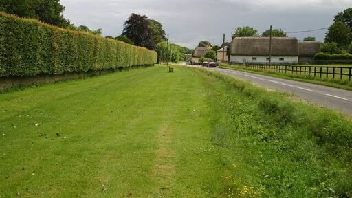 Road into Appleshaw Road into Appleshaw with village church behind the end of the hedge