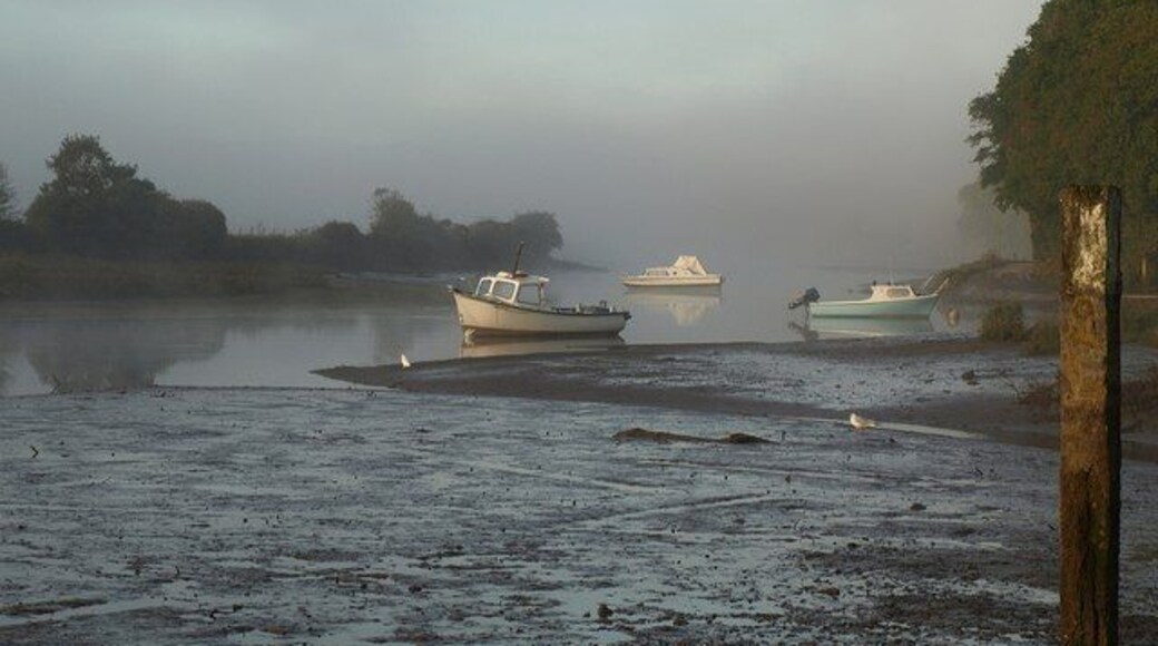 Boats on the Avon Morning mist hangs over the upper Avon estuary. The tidal mudflats are crossed by a stream from the Ashford valley joining the Avon from the north (right).