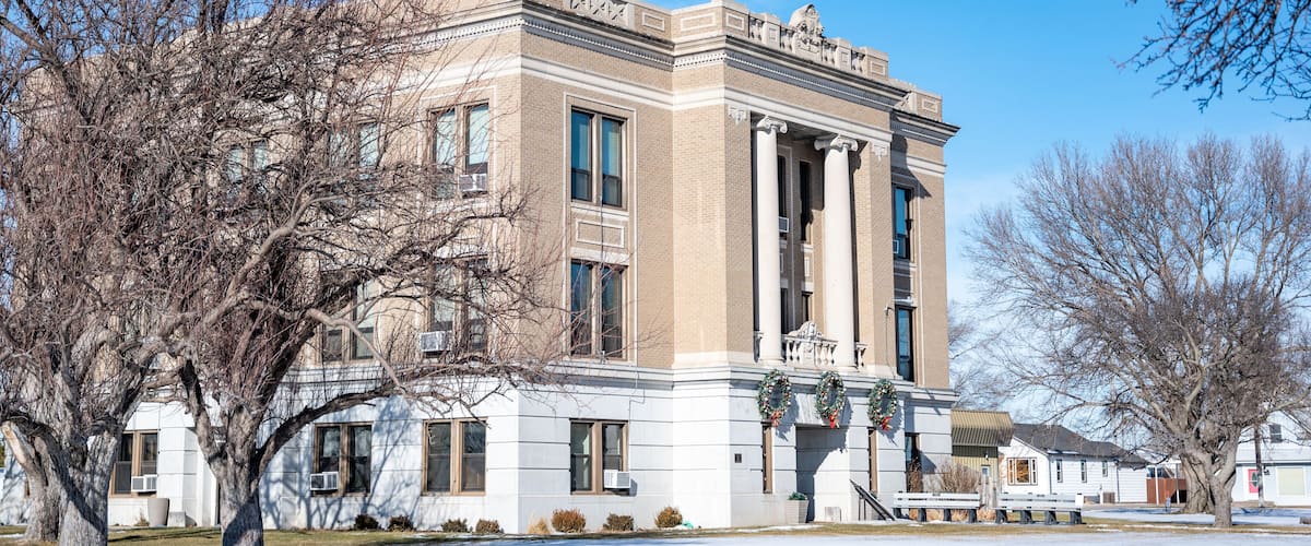 A historic building with a classical architectural style, featuring tall columns and a symmetrical facade.