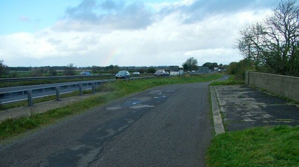 Service Road About To Disappear This handy service road is often used as a sneaky slip road from the southbound A1, crossing the old rail bridge and passing the old Sinderby station. Soon to all be bulldozed for the long threatened A1 motorway upgrade.