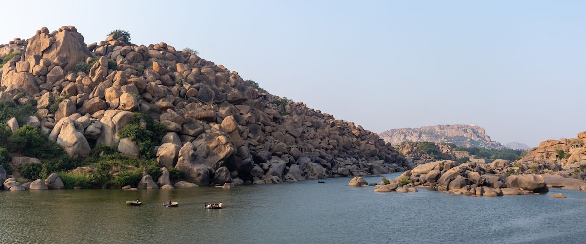 A river with large boulders and a rocky landscape.
