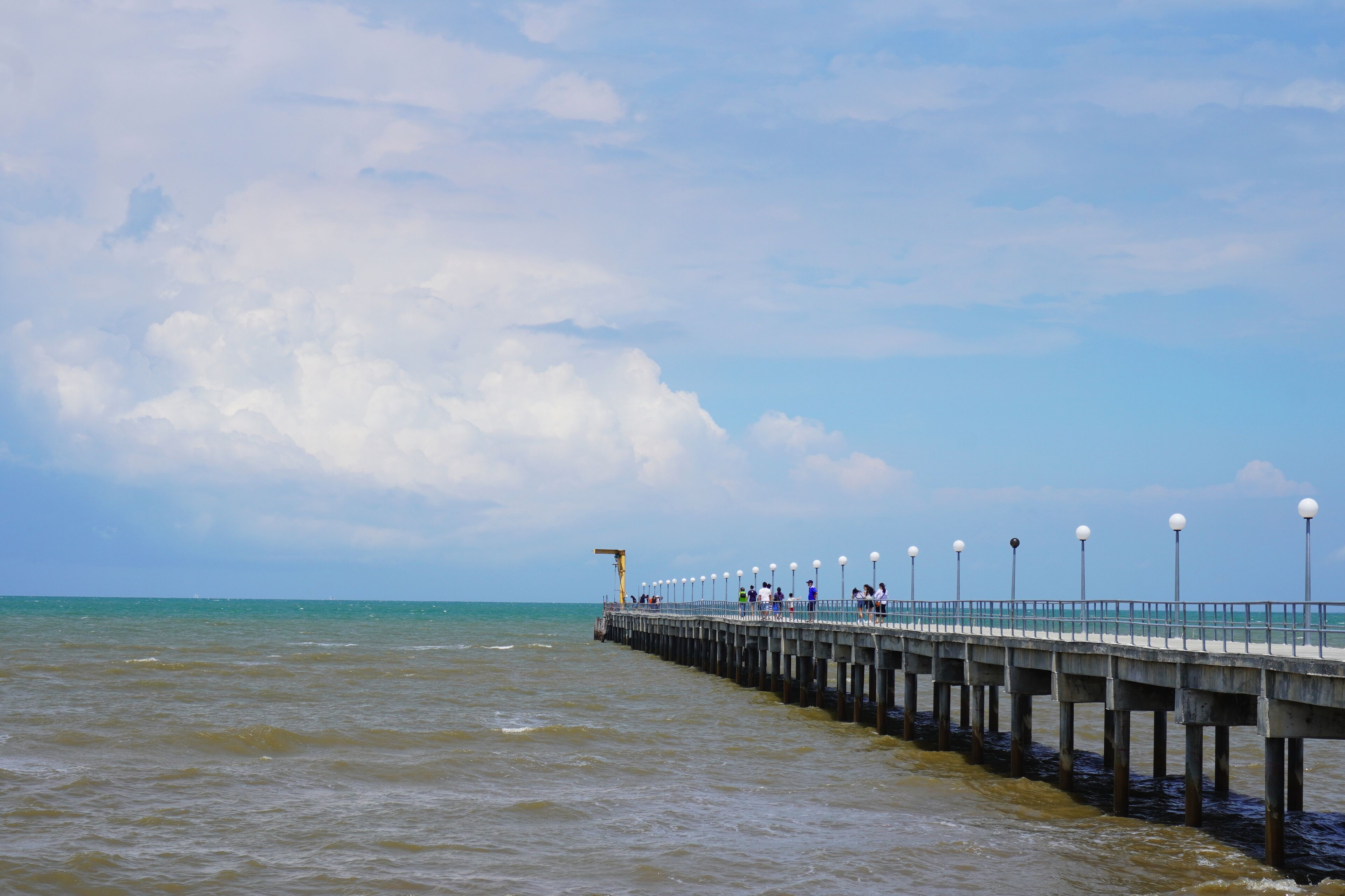  The lover's bridge is a concrete pier that leads far out to sea, with a jetty at the end that allows fishing boats to dock at Tanjung Sepat.