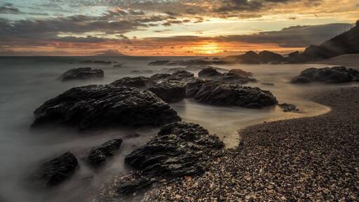 Te Arai point, a couple of hours north of Auckland, New Zealand. This was the last sunrise of 2014