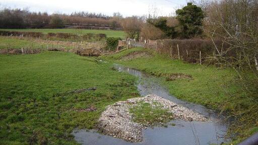 Haw Bridge near Holybourne. This is a little winterbourne feeding the River Wey which goes under the bridge in the middle. You may be able to just make out the Holybourne oil loading depot in the background.