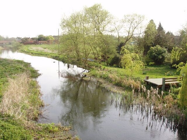Landing Stage The River Wensum glides through the heart of North Norfolk - and here it passes the gardens of cottages on the edge of Great Ryburgh village. So what better place to have a landing stage or fishing platform.