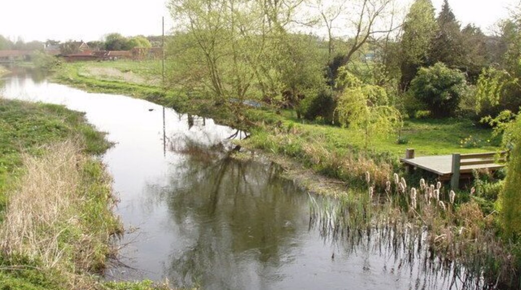Landing Stage The River Wensum glides through the heart of North Norfolk - and here it passes the gardens of cottages on the edge of Great Ryburgh village. So what better place to have a landing stage or fishing platform.