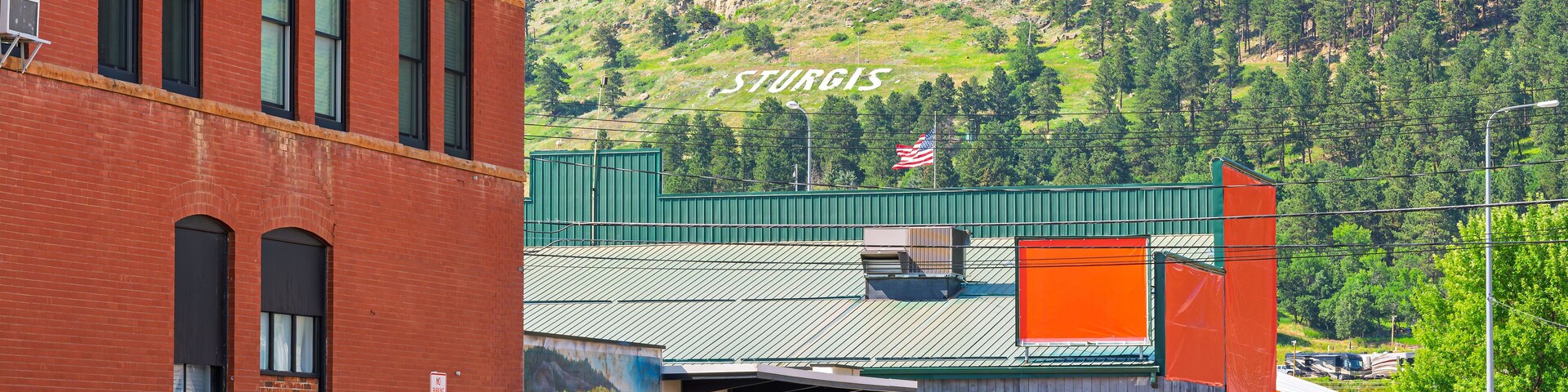 The iconic Sturgis letters sign on a hillside above the small town of Sturgis, South Dakota, home of the annual Sturgis Motorcycle Rally.
