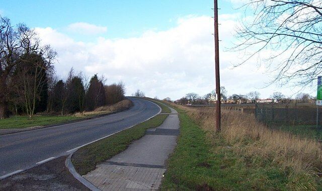 Sim Balk Lane View along Sim Balk Lane as it passes over the A64 in the distance.