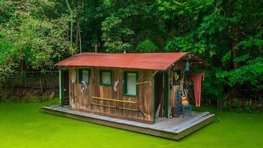 The houseboat at the zoo feels like a floating dream amidst the wild wonders around it, Audubon Zoo, New Orleans, Louisiana, United States of America