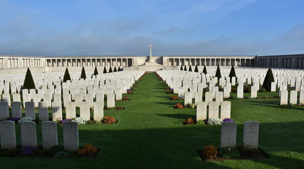 Pozières British Cemetery is enclosed within the boundary wall incorporating the Pozières Memorial to the Missing of 1918.
Burials made during 1916, 1917 and 1918 are contained in Plot II and these were made at that time by the fighting units or field ambulances in position here near Pozières.
All other graves were brought to this cemetery after the Armistice in November 1918. Most of the graves were brought here from battlefield burials in the vicinity of this cemetery. Most of these casualties were British and Commonwealth soldiers who were killed in the surrounding fields during the autumn battles of the 1916 Battle of the Somme. Some were casualties discovered in isolated burial plots and small cemeteries from the fighting in August 1918.
There are now 2,758 Commonwealth servicemen buried or commemorated in this cemetery. 1,380 of the burials are unidentified but there are special memorials to 23 casualties known or believed to be buried among them. There is also one German soldier buried here.