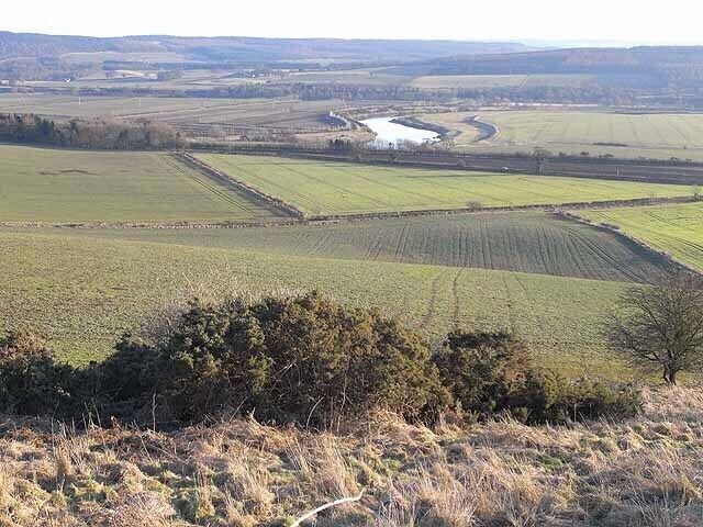 Tyne valley Seen from the hillside near Beaufront Castle. On this side of the river can be seen the back road from Corbridge to Hexham (Corchester Lane) with the A69 a short way beyond. The tributary valley of the Devil's Water can be seen on the far side.