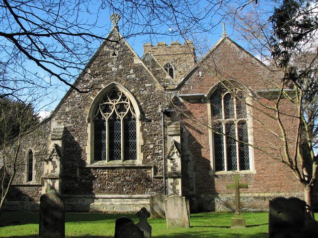 Holy Trinity church in Stow Bardolph. The Hare Chapel - almost as big as the chancel - can be seen at right. The church of the Holy Trinity > 1737301 is situated in a cul-de-sac, flanked by the old rectory which presently serves as a Preparatory school and Montessori nursery. Church Farm Rare Breeds Centre is a little further down the lane towards where the road ends, bisected by the A10 road. The church is of Norman origins and was extensively restored in the mid-1800s, the architect having been John Raphael Brandon. The church furnishings > 1737324 date from this time but the Charles II (1630-1685) royal arms > 1737336 is described as being one of the finest sets in Norfolk. The most noteworthy feature of the church is the Hare Chapel > 1737312 and the monuments it houses. The chapel was built by John Hare in 1642 as a mausoleum for members of the Hare family. Accessible via a door in the chancel south wall one steps into a light and airy room which houses a number of extraordinary monuments dating from the 17th to the 19th century > 1737355 - 1737351.