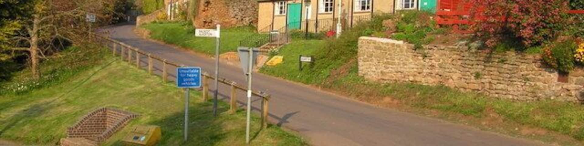 Village Hall, Shutford View up Banbury Hill showing the village hall. The road to the left is Ivy Lane, and on the right is the garden of the George and Dragon pub.