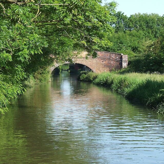 Bridge No 38, Oxford Canal west of Cathiron, Warwickshire. The bridge carries a farm track and a public bridleway.