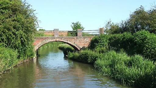 Bridge No 37 over Oxford Canal southwest of Easenhall, Warwickshire. It carries a farm track and a public footpath between Easenhall and King's Newnham.