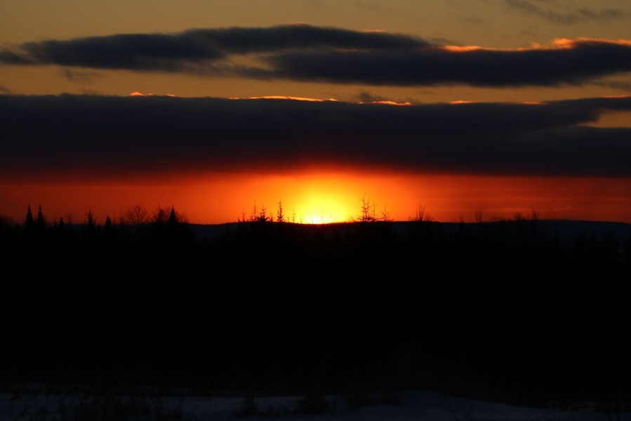 Small hill on Aroostook Road (Route 11) overlooking a valley with awesome sunsets.