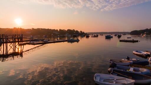 Round Pond Harbor, Maine, USA, boats in the harbor on a quiet still morning at sunrise in summer