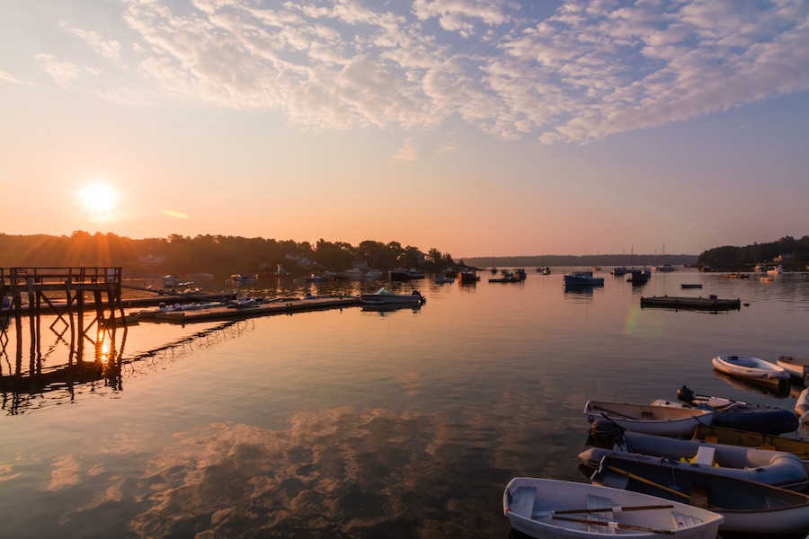 Round Pond Harbor, Maine, USA, boats in the harbor on a quiet still morning at sunrise in summer