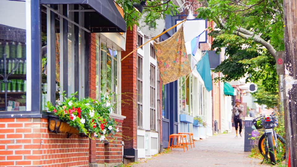 Romantic backstreet, side street or alley in historic old town of Portland, Maine with New England style architecture facades, a landmark sightseeing tourist spot in downtown