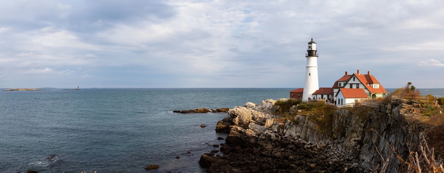 Beautiful panoramic view of Portland Head Lighthouse on the Atlantic Ocean Coast. Taken in Fort Williams Park, Portland, Maine, United States.