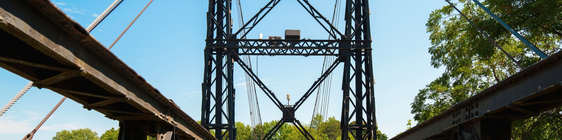 The Ticonic Footbridge, also known as the Two Cent Bridge, a historic 1903 suspension bridge over the Kennebec River, linking Waterville and Winslow in Kennebec County, Maine, USA