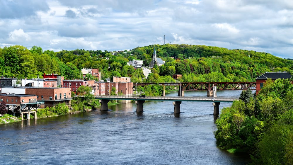 Aerial view of Calumet Bridge and Maine Central Railroad Bridge across the Kennebec River in Augusta, Maine, United States