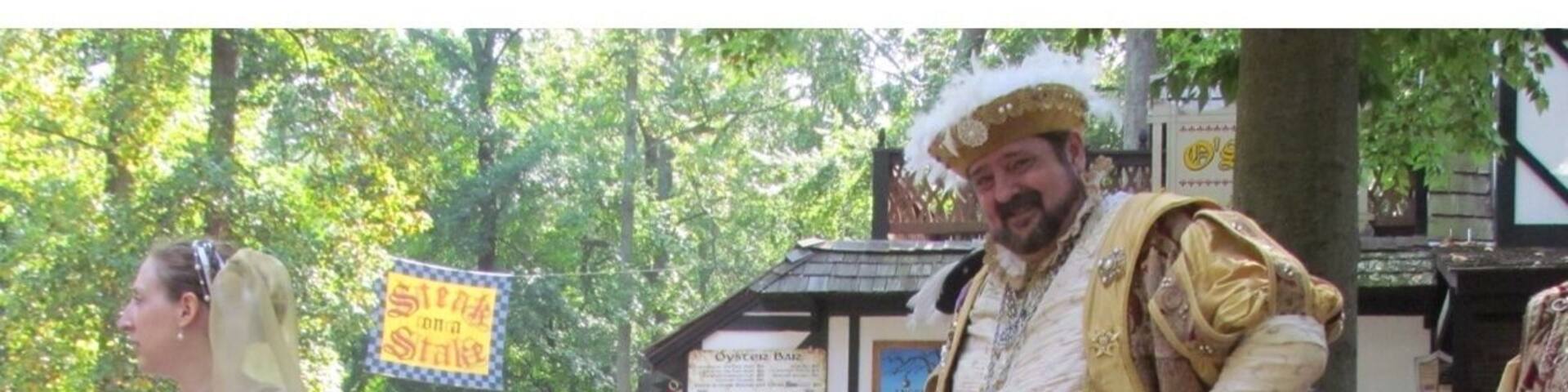 Their Majesties greeting a young visitor.