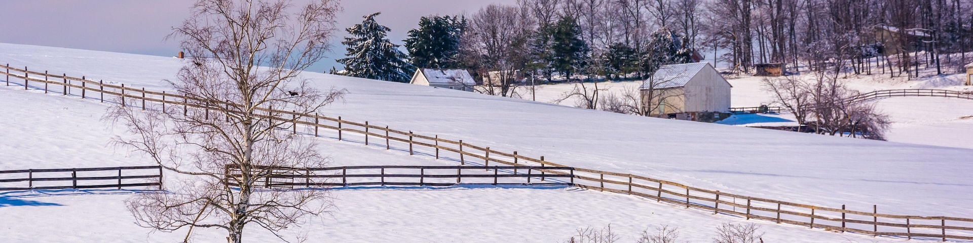 Snow covered farm fields in rural Carroll County, Maryland.