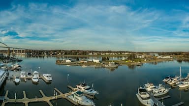 Aerial panorama of Chesapeake City Maryland historic fishing town on the Chesapeake Delaware canal with private boats docked in the marina and the Chesapeake City Bridge over the back creek