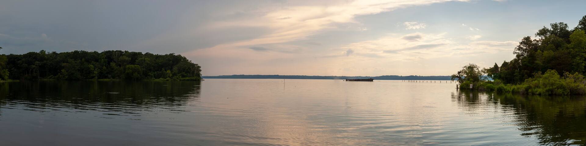 Panoramic image of the Mallows Bay, on the Maryland side of Potomac River. This place is home to over a hundred shipwrecks (ghost fleet) including the one seen in the background.