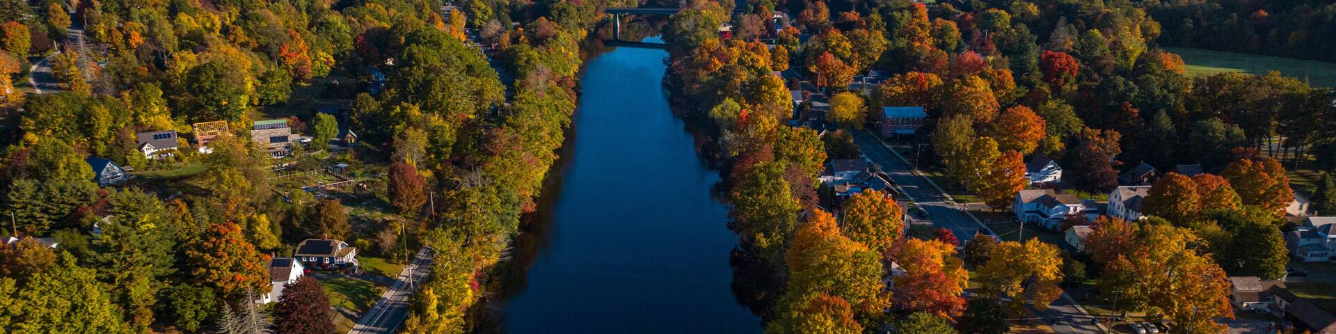 10/12/22 SHEFFIELD FALLS, MA., USA - aerial view Housatonic River running through town, Berkshire Mountains
