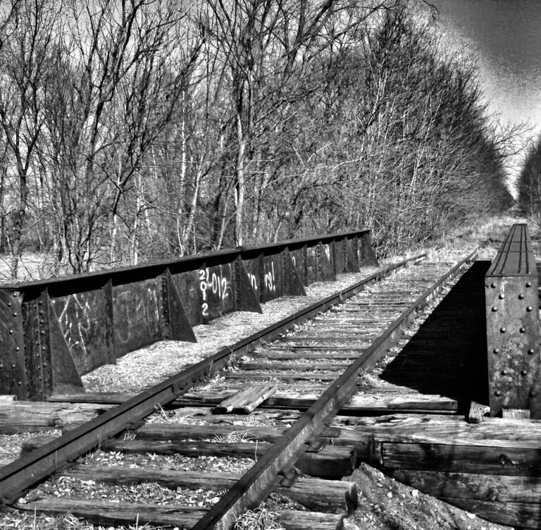 I found this cool old iron bridge over the river on the abandoned railroad tracks running adjacent to the park I came across.

#Michigan #PureMichigan #Railway #Railroad #Train #TrainTracks #abandoned #BlackandWhite #BandW