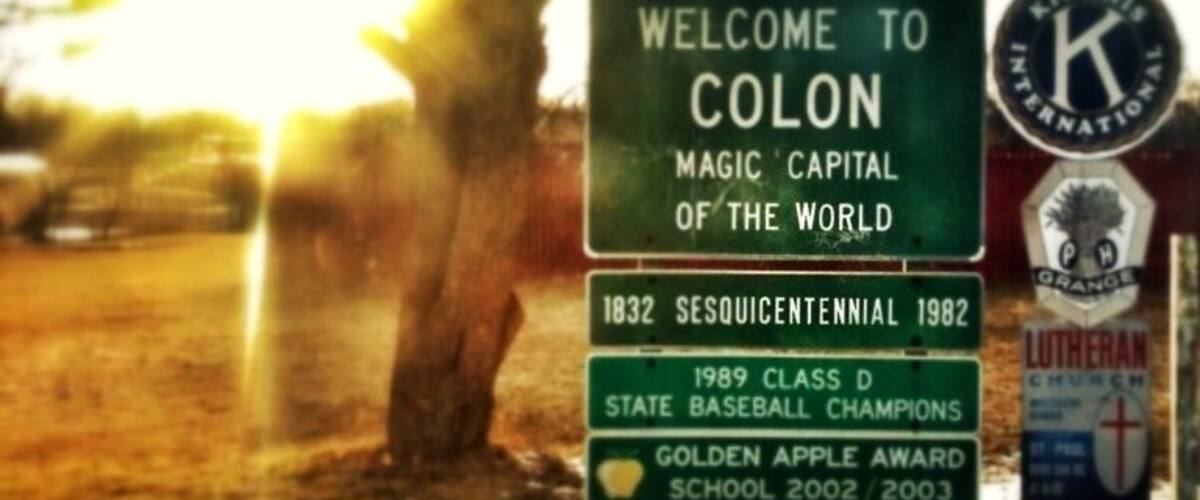 A sign welcoming visitors to Colon, highlighting its historical significance and achievements in baseball.
