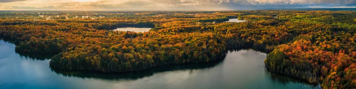 Spectacular autumn sunset over Pete’s Lake Campground in the Hiawatha National Forest – Michigan Upper Peninsula – aerial view