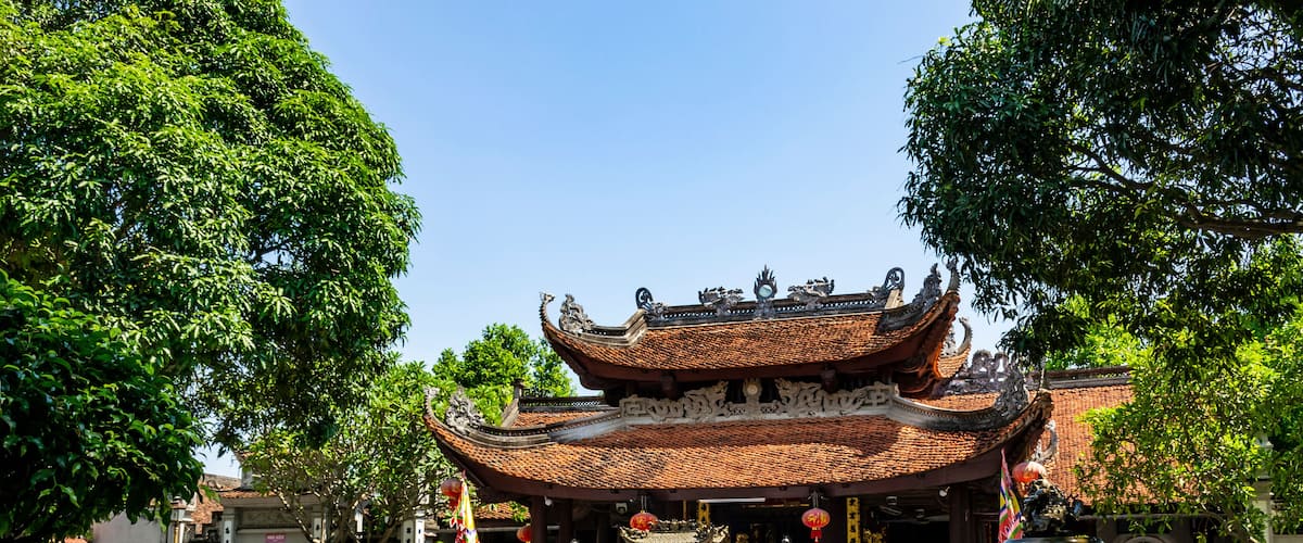 A traditional Chinese temple with ornate architecture, including a curved roof and decorative dragons.