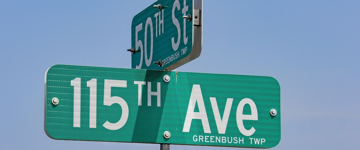 Street signs for 50th St and 115th Ave in Greenbush TWP.