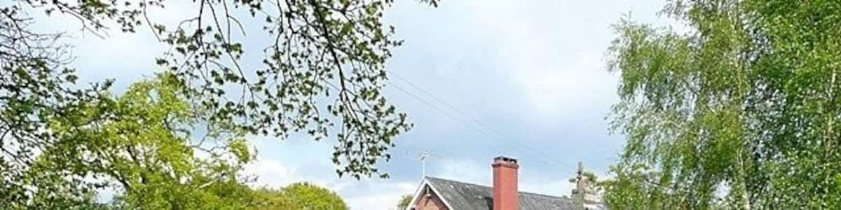 Pink house at Harbridge Green. This is on the Avon Valley Path from Christchurch to Salisbury. This house is a mixture of pink render and original russet bricks, see in close up here 1525879