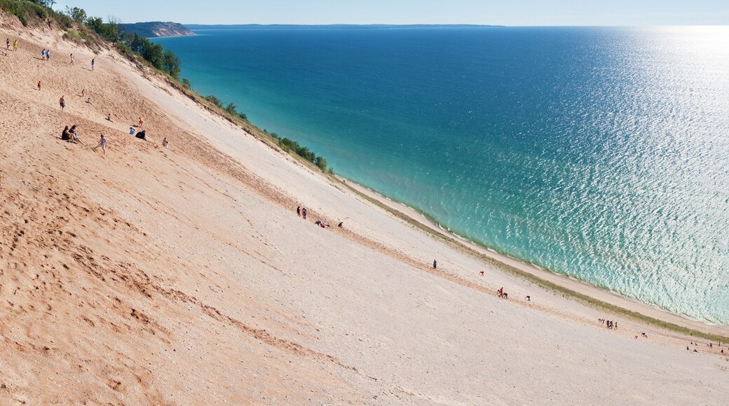 Tourists climbing a popular dune at Sleeping Bear Dunes.