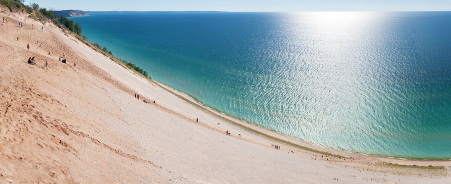 Tourists climbing a popular dune at Sleeping Bear Dunes.
