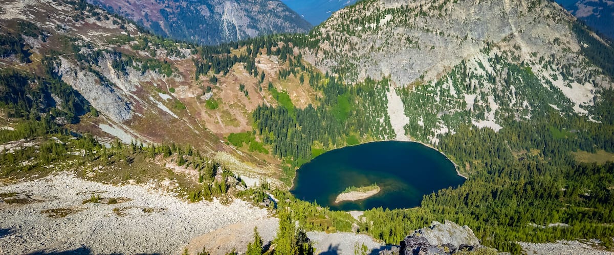 A mountain range with a lake nestled in the valley.