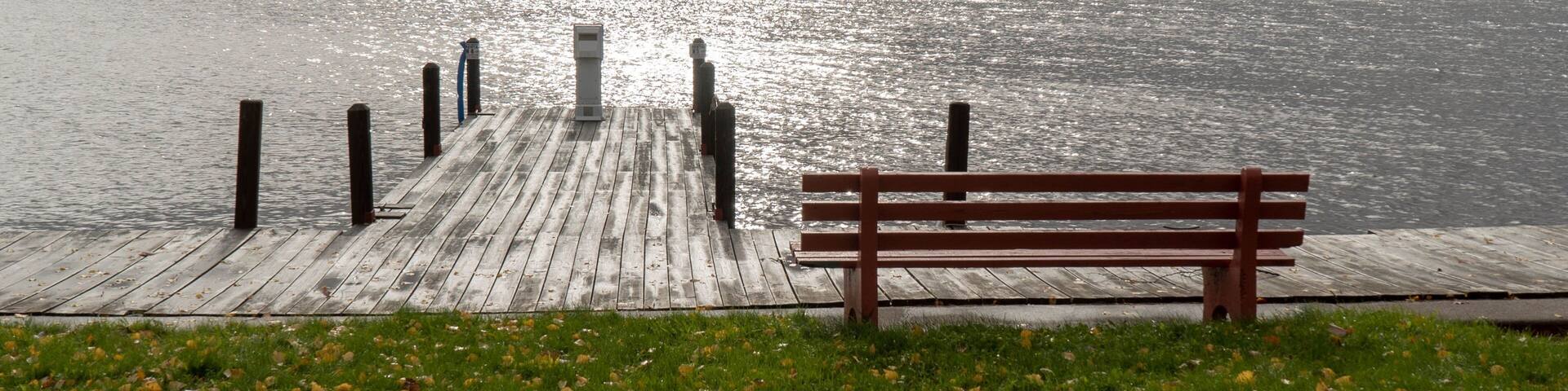 Lake Linden in Upper Peninsula of Michigan on a stormy day overlooking boat dock and park bench