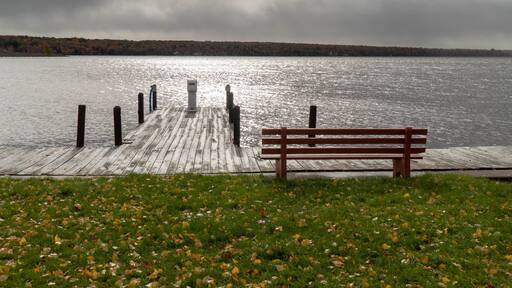 Lake Linden in Upper Peninsula of Michigan on a stormy day overlooking boat dock and park bench