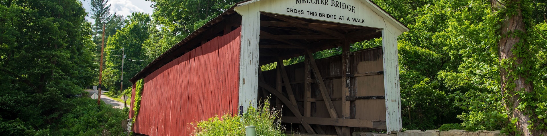 The Melcher Covered Bridge, also known as the Klondyke, Marion, or the Leatherwood Covered Bridge crosses Leatherwood Creek east of Montezuma in Parke County, Indiana